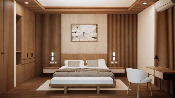 A luxurious king-size bed with muted tones and a beautiful floral painting above, set against stylish wooden walls.