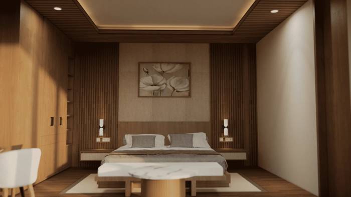 A serene bedroom with a large bed, wood-paneled walls, modern lighting, and a floral painting above the headboard.