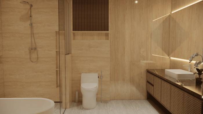 A luxurious bathroom with warm travertine walls, a sleek shower, modern toilet, and a vanity with a white vessel sink.
