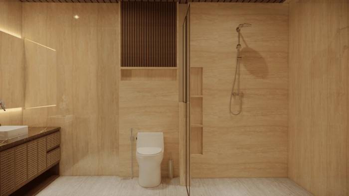 A luxury bathroom with travertine walls, a modern vanity with a white sink, a toilet, and a glass-enclosed shower.