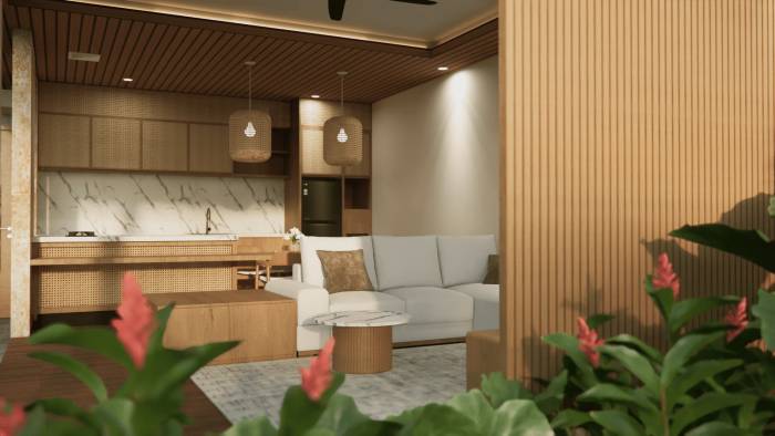 Modern open-plan living area with kitchen, white sofa, wooden accents, marble backsplash, and tropical plants.