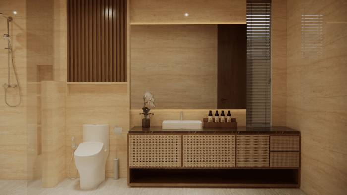 A luxurious bathroom in an Ubud villa, featuring light marble walls, a modern vanity with rattan details, and a spacious shower.